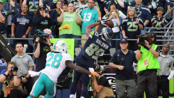 Sep 11, 2016; Seattle, WA, USA; Seattle Seahawks tight end Brandon Williams (86) catches a 2-yard touchdown pass as Miami Dolphins cornerback Bobby McCain (28) defends with 31 seconds to play during a NFL game at CenturyLink Field. The Seahawks defeated the Dolphins 12-10. Mandatory Credit: Kirby Lee-USA TODAY Sports