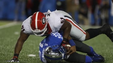 Nov 5, 2016; Lexington, KY, USA; Georgia Bulldogs linebacker David Marshall (51) tackles Kentucky Wildcats quarterback Stephen Johnson (15) in the first half at Commonwealth Stadium. Mandatory Credit: Mark Zerof-USA TODAY Sports
