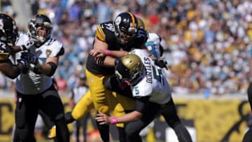 Oct 5, 2014; Jacksonville, FL, USA; Pittsburgh Steelers defensive end Brett Keisel (99) hits Jacksonville Jaguars quarterback Blake Bortles (5) as the Steelers beat the Jaguars 17-9 at EverBank Field. Mandatory Credit: David Manning-USA TODAY Sports