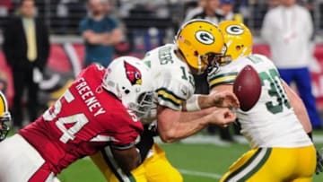 Dec 27, 2015; Glendale, AZ, USA; Arizona Cardinals inside linebacker Kenny Demens (54) sacks Green Bay Packers quarterback Aaron Rodgers (12) and strips the ball during the second half at University of Phoenix Stadium. Mandatory Credit: Matt Kartozian-USA TODAY Sports