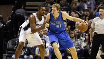 Oct 28, 2014; San Antonio, TX, USA; Dallas Mavericks power forward Dirk Nowitzki (41) is defended by San Antonio Spurs power forward Boris Diaw (left) during the first half at AT&T Center. Mandatory Credit: Soobum Im-USA TODAY Sports