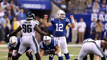 Sep 15, 2014; Indianapolis, IN, USA; Indianapolis Colts quarterback Andrew Luck (12) motions at the line of scrimmage during a game against the Philadelphia Eagles at Lucas Oil Stadium. Philadelphia defeats Indianapolis 30-27. Mandatory Credit: Brian Spurlock-USA TODAY Sports