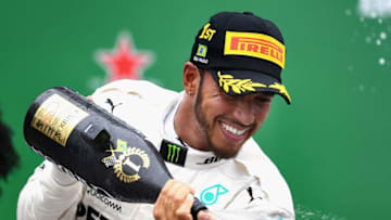 SAO PAULO, BRAZIL - NOVEMBER 11: Race winner Lewis Hamilton of Great Britain and Mercedes GP celebrates on the podium during the Formula One Grand Prix of Brazil at Autodromo Jose Carlos Pace on November 11, 2018 in Sao Paulo, Brazil. (Photo by Clive Mason/Getty Images)