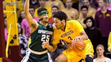 Jan 2, 2016; Minneapolis, MN, USA; Minnesota Gophers forward Jordan Murphy (3) dribbles in the first half against the Michigan State Spartans forward Kenny Goins (25) at Williams Arena. Mandatory Credit: Brad Rempel-USA TODAY Sports