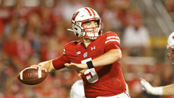 Sep 11, 2021; Madison, Wisconsin, USA; Wisconsin Badgers quarterback Graham Mertz (5) throws a pass during the fourth quarter against the Eastern Michigan Eagles at Camp Randall Stadium. Mandatory Credit: Jeff Hanisch-USA TODAY Sports
