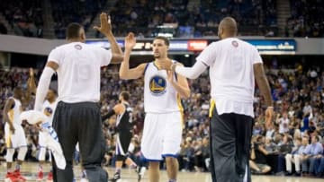 Nov 7, 2015; Sacramento, CA, USA; Golden State Warriors guard Klay Thompson (11) high fives teammates as a timeout is called after a basket against the Sacramento Kings during the fourth quarter at Sleep Train Arena. The Golden State Warriors defeated the Sacramento Kings 103-94. Mandatory Credit: Kelley L Cox-USA TODAY Sports
