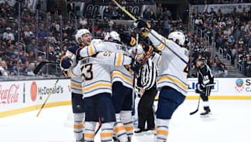 LOS ANGELES, CA - OCTOBER 20: Jack Eichel #9, Jeff Skinner #53, Marco Scandella #6 and Zach Bogosian #4 of the Buffalo Sabres celebrate Skinner's second-period goal during the game against the Los Angeles Kings at STAPLES Center on October 20, 2018 in Los Angeles, California. (Photo by Adam Pantozzi/NHLI via Getty Images)