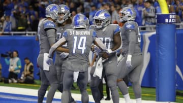 DETROIT, MICHIGAN - OCTOBER 30: Jamaal Williams #30 of the Detroit Lions celebrates a touchdown with teammates against the Miami Dolphins during the first quarter at Ford Field on October 30, 2022 in Detroit, Michigan. (Photo by Leon Halip/Getty Images)