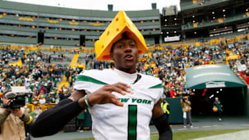 Oct 16, 2022; Green Bay, Wisconsin, USA; New York Jets cornerback Sauce Gardner (1) celebrates defeating the Green Bay Packers by wearing a cheesehead on the field following the game at Lambeau Field. Mandatory Credit: Jeff Hanisch-USA TODAY Sports