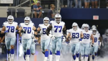 Oct 3, 2021; Arlington, Texas, USA; Dallas Cowboys offensive tackle Tyron Smith (77) runs on the field before the game against the Carolina Panthers at AT&T Stadium. Mandatory Credit: Tim Heitman-USA TODAY Sports