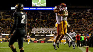 BOULDER, CO - OCTOBER 25: Tyler Vaughns #21 and Kedon Slovis #9 of the USC Trojans celebrate after a fourth quarter touchdown against the Colorado Buffaloes at Folsom Field on October 25, 2019 in Boulder, Colorado. (Photo by Dustin Bradford/Getty Images)