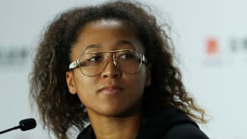 SHENZHEN, CHINA - OCTOBER 29: Naomi Osaka of Japan fields questions from the media during a press conference after withdrawing from the tournament due to a right shoulder injury on Day Three of the 2019 Shiseido WTA Finals at Shenzhen Bay Sports Center on October 29, 2019 in Shenzhen, China. (Photo by Matthew Stockman/Getty Images)