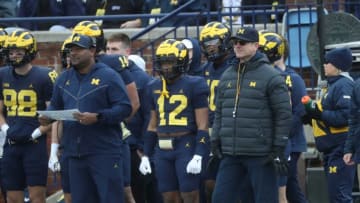 Michigan Wolverines assistant coach Ron Bellamy, left, and head coach Jim Harbaugh, right, watch the action during the spring game Saturday, April 1, 2023 at Michigan Stadium.Umspring 040123 Kd1918