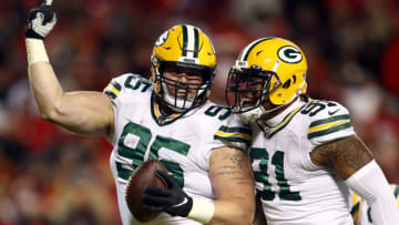 KANSAS CITY, MISSOURI - OCTOBER 27: Defensive tackle Tyler Lancaster #95 of the Green Bay Packers celebrates with outside linebacker Preston Smith #91 after recovering a fumble in the 4th quarter during the game against the Kansas City Chiefs at Arrowhead Stadium on October 27, 2019 in Kansas City, Missouri. (Photo by Jamie Squire/Getty Images)