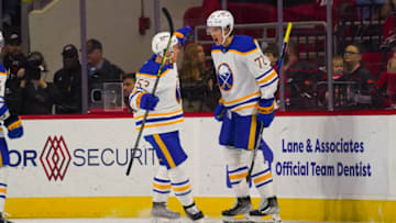 Apr 7, 2022; Raleigh, North Carolina, USA; Buffalo Sabres right wing Tage Thompson (72) is congratulated by left wing Jeff Skinner (53) after his goal against the Carolina Hurricanes during the first period at PNC Arena. Mandatory Credit: James Guillory-USA TODAY Sports