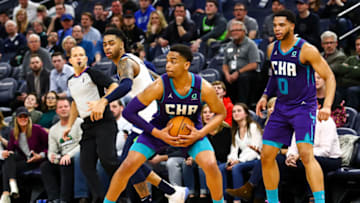 MINNEAPOLIS, MN - FEBRUARY 12: PJ Washington #25 of the Charlotte Hornets steals the ball against D'Angelo Russell #0 of the Minnesota Timberwolves in the fourth quarter of the game at Target Center on February 12, 2020 in Minneapolis, Minnesota. The Hornets defeated the Timberwolves 115-108. NOTE TO USER: User expressly acknowledges and agrees that, by downloading and or using this Photograph, user is consenting to the terms and conditions of the Getty Images License Agreement. (Photo by David Berding/Getty Images)