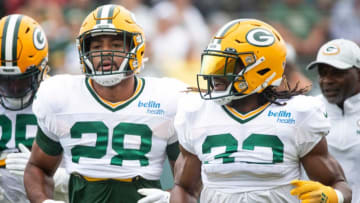 Green Bay Packers running back AJ Dillon (28) and running back Aaron Jones (33) run to their next drill during training camp on Monday, Aug. 8, 2022, at Ray Nitschke Field in Ashwaubenon, Wis. Samantha Madar/USA TODAY NETWORK-Wis.Gpg Training Camp 08082022 0002