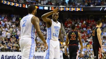 Mar 16, 2013; Greensboro, NC, USA; North Carolina Tar Heels guard P.J. Hairston (15) rects with guard Leslie McDonald (2) as Maryland Terrapins guard/forward Dez Wells (32) and center Alex Len (25) are in the background in the second half. The Tar Heels defeated the Terrapins 79-76 during the semifinals of the ACC tournament at Greensboro Coliseum. Mandatory Credit: Bob Donnan-USA TODAY Sports