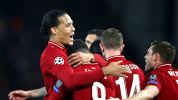 LIVERPOOL, ENGLAND - APRIL 09: Roberto Firmino of Liverpool celebrates after scoring his team's second goal with Virgil van Dijk of Liverpool during the UEFA Champions League Quarter Final first leg match between Liverpool and Porto at Anfield on April 09, 2019 in Liverpool, England. (Photo by Julian Finney/Getty Images)