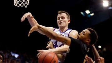 LAWRENCE, KS - NOVEMBER 24: Mitch Lightfoot #44 of the Kansas Jayhawks and Nick Daniels #2 of the Oakland Golden Grizzlies battle for a rebound during the game at Allen Fieldhouse on November 24, 2017 in Lawrence, Kansas. (Photo by Jamie Squire/Getty Images)
