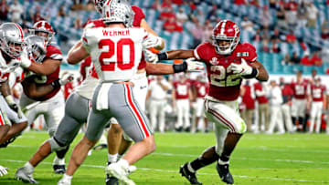 Jan 11, 2021; Miami Gardens, Florida, USA; Alabama Crimson Tide running back Najee Harris (22) runs the ball against Ohio State Buckeyes linebacker Pete Werner (20) during the third quarter in the 2021 College Football Playoff National Championship Game. Mandatory Credit: Kim Klement-USA TODAY Sports