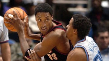 CLEVELAND, UNITED STATES: Portland Trail Blazers guard Scottie Pippen (L) works against Cleveland Cavaliers guard Andre Miller (R) during the first quarter, 07 January, 2002 at Gund Arena in Cleveland, Ohio. Portland defeated Cleveland 98-72. AFP PHOTO/DAVID MAXWELL (Photo credit should read DAVID MAXWELL/AFP via Getty Images)