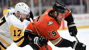 Bryan Rust #17 of the Pittsburgh Penguins battles Ryan Getzlaf #15 of the Anaheim Ducks (Photo by Sean M. Haffey/Getty Images)
