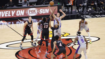 MIAMI, FLORIDA - JANUARY 18: Bam Adebayo #13 of the Miami Heat and Mason Plumlee #24 of the Detroit Pistons (Photo by Michael Reaves/Getty Images)