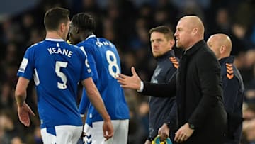 Everton's English manager Sean Dyche (R) talks to Everton's English defender Michael Keane during the English Premier League football match between Everton and Newcastle United at Goodison Park in Liverpool, north-west England on April 27, 2023. (Photo by Oli SCARFF / AFP) / RESTRICTED TO EDITORIAL USE. No use with unauthorized audio, video, data, fixture lists, club/league logos or 'live' services. Online in-match use limited to 120 images. An additional 40 images may be used in extra time. No video emulation. Social media in-match use limited to 120 images. An additional 40 images may be used in extra time. No use in betting publications, games or single club/league/player publications. / (Photo by OLI SCARFF/AFP via Getty Images)