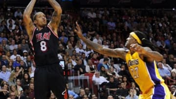 Jan 23, 2014; Miami, FL, USA; Miami Heat small forward Michael Beasley (8) shoots over Los Angeles Lakers power forward Jordan Hill (27) during the second half at American Airlines Arena. Mandatory Credit: Steve Mitchell-USA TODAY Sports