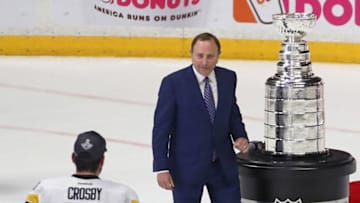 NHL Commissioner, Gary Bettman and Sidney Crosby #87 of the Pittsburgh Penguins. (Photo by Frederick Breedon/Getty Images)