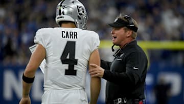 INDIANAPOLIS, IN - SEPTEMBER 29: Head coach Jon Gruden of the Oakland Raiders talks to Derek Carr #4 during a timeout in the fourth quarter of the game against the Indianapolis Colts at Lucas Oil Stadium on September 29, 2019 in Indianapolis, Indiana. (Photo by Bobby Ellis/Getty Images)