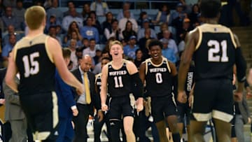 CHAPEL HILL, NORTH CAROLINA - DECEMBER 15: Ryan Larson #11 of the Wofford Terriers and Zion Richardson #0 of the Wofford Terriers react following a play against the North Carolina Tar Heels during their game at Carmichael Arena on December 15, 2019 in Chapel Hill, North Carolina. (Photo by Jared C. Tilton/Getty Images)