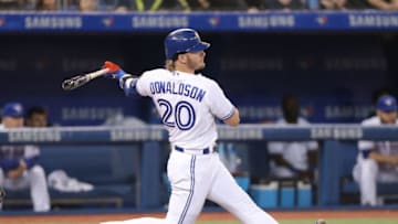 TORONTO, ON - MAY 12: Josh Donaldson #20 of the Toronto Blue Jays bats in the third inning during MLB game action against the Boston Red Sox at Rogers Centre on May 12, 2018 in Toronto, Canada. (Photo by Tom Szczerbowski/Getty Images) *** Local Caption *** Josh Donaldson