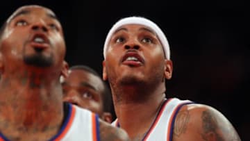 Nov 10, 2014; New York, NY, USA; New York Knicks small forward Carmelo Anthony (7) and New York Knicks shooting guard J.R. Smith (8) watch a foul shot during the fourth quarter against the Atlanta Hawks at Madison Square Garden. The Hawks defeated the Knicks 91-85. Mandatory Credit: Brad Penner-USA TODAY Sports