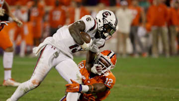 CLEMSON, SC - NOVEMBER 24: K'Von Wallace #12 of the Clemson Tigers tries to stop Shi Smith #13 of the South Carolina Gamecocks during their game at Clemson Memorial Stadium on November 24, 2018 in Clemson, South Carolina. (Photo by Streeter Lecka/Getty Images)