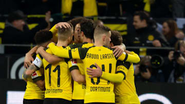 DORTMUND, GERMANY - DECEMBER 01: Marco Reus of Dortmund celebrates after scoring his team's first goal with team mates during the Bundesliga match between Borussia Dortmund and Sport-Club Freiburg at Signal Iduna Park on December 01, 2018 in Dortmund, Germany. (Photo by TF-Images/Getty Images)