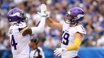 EAST RUTHERFORD, NEW JERSEY - OCTOBER 06: Stefon Diggs #14 of the Minnesota Vikings congratulates teammate Adam Thielen #19 after he scored a touchdown in the third quarter against the New York Giants at MetLife Stadium on October 06, 2019 in East Rutherford, New Jersey. (Photo by Elsa/Getty Images)