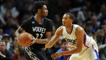 February 3, 2016; Los Angeles, CA, USA; Minnesota Timberwolves guard Andrew Wiggins (22) controls the ball against Los Angeles Clippers forward Wesley Johnson (33) during the second half at Staples Center. Mandatory Credit: Gary A. Vasquez-USA TODAY Sports