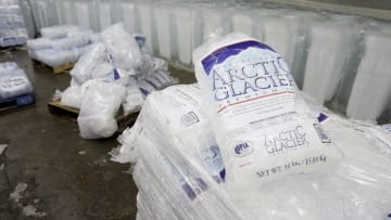 NEW YORK - AUGUST 2: Blocks and bags of ice rest in the freezer at the Losquardo/Arctic Glacier Ice Company August 2, 2006 in the Brooklyn borough of New York City. Company owner Iggy Scalavino said the heat wave has caused a jump in their normal daily production of 400 tons of ice. (Photo by Stephen Chernin/Getty Images)