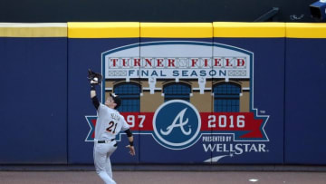 May 29, 2016; Atlanta, GA, USA; Miami Marlins left fielder Christian Yelich (21) makes a catch for an out of Atlanta Braves first baseman Freddie Freeman (not pictured) in the 4th inning of their game at Turner Field. Mandatory Credit: Jason Getz-USA TODAY Sports