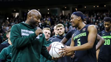 Cassius Winston #5 of the Michigan State Spartans receives a commemorative ball from Former Spartan Mateen Cleaves for breaking his Big Ten assist record . (Photo by Rey Del Rio/Getty Images)