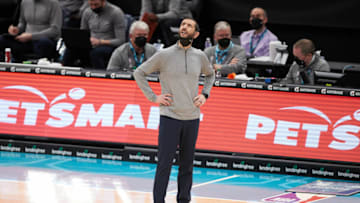 May 7, 2021; Charlotte, North Carolina, USA; Charlotte Hornets head coach James Borrego looks up at the video board during third quarter action against the Orlando Magic at Spectrum Center. Mandatory Credit: Brian Westerholt-USA TODAY Sports