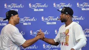 Jun 20, 2013; Miami, FL, USA; Miami Heat shooting guard Dwyane Wade celebrates with small forward Shane Battier (left) during a press conference after game seven in the 2013 NBA Finals at American Airlines Arena. Miami Heat won 95-88 to win the NBA Championship. Mandatory Credit: Steve Mitchell-USA TODAY Sports
