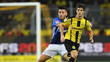 DORTMUND, GERMANY - OCTOBER 29: Christian Pulisic of Dortmund is challenged by Sead Kolasinac of Schalke during the Bundesliga match between Borussia Dortmund and FC Schalke 04 at Signal Iduna Park on October 29, 2016 in Dortmund, Germany. (Photo by Stuart Franklin/Bongarts/Getty Images)