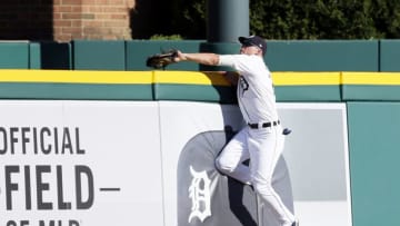 DETROIT, MI - JULY 7: Center fielder JaCoby Jones #21 of the Detroit Tigers reaches over the wall to catch a fly ball hit by Adrian Beltre of the Texas Rangers during the sixth inning at Comerica Park on July 7, 2018 in Detroit, Michigan. (Photo by Duane Burleson/Getty Images)