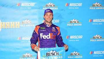 HOMESTEAD, FL - NOVEMBER 16: Denny Hamlin, driver of the #11 FedEx Express Toyota, poses with the poll award after qualifying for the Monster Energy NASCAR Cup Series Ford EcoBoost 400 at Homestead-Miami Speedway on November 16, 2018 in Homestead, Florida. (Photo by Jared C. Tilton/Getty Images)