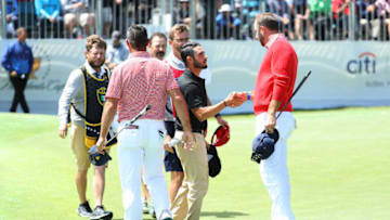 MELBOURNE, AUSTRALIA - DECEMBER 12: Abraham Ancer of Mexico and the International team and Louis Oosthuizen (not pictured) of South Africa and the International team shake hands with Gary Woodland of the United States team and Dustin Johnson of the United States team after defeating them 4&3 on the 15th green during Thursday four-ball matches on day one of the 2019 Presidents Cup at Royal Melbourne Golf Course on December 12, 2019 in Melbourne, Australia. (Photo by Warren Little/Getty Images)