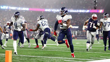 FOXBOROUGH, MASSACHUSETTS - JANUARY 04: Derrick Henry #22 of the Tennessee Titans carries the ball against the New England Patriots in the second quarter of the AFC Wild Card Playoff game at Gillette Stadium on January 04, 2020 in Foxborough, Massachusetts. (Photo by Adam Glanzman/Getty Images)