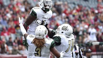 Sep 24, 2016; Philadelphia, PA, USA; Charlotte 49ers wide receiver Workpeh Kofa (6) celebrates his touchdown with offensive lineman Eugene German (75) and running back Kalif Phillips (3) during the first quarter against the Temple Owls at Lincoln Financial Field. Mandatory Credit: Derik Hamilton-USA TODAY Sports